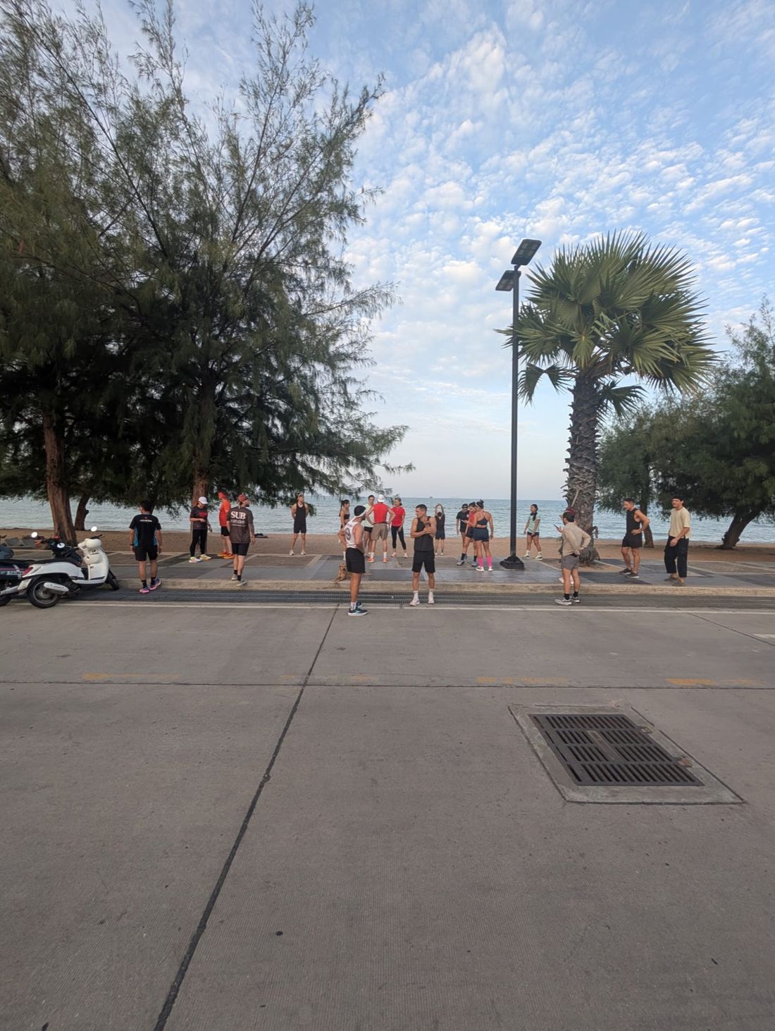 Runners warming up on Dongtan Beach at sunrise